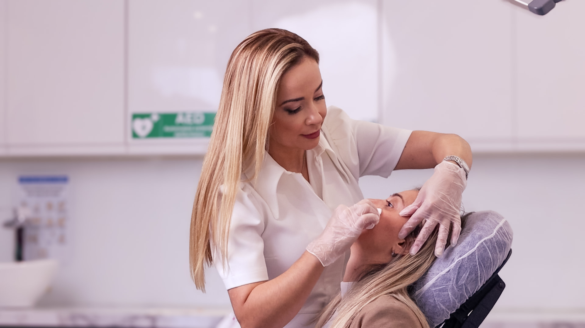 Practitioner preparing a client for treatment at LN Clinic