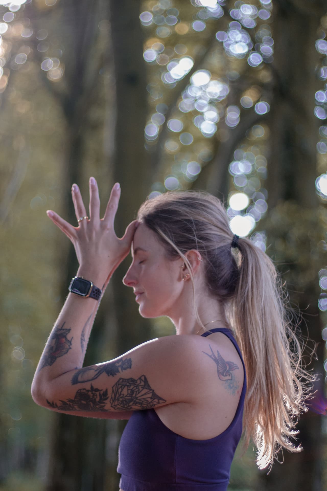 Close-up portrait in a woodland meditation pose